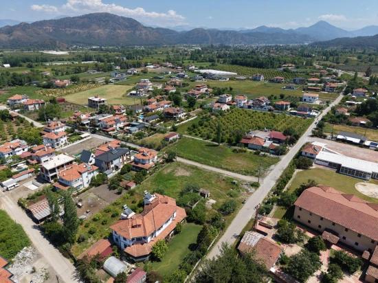 Land For Sale In Okçular, 1050m2, In The Village Residential Area.